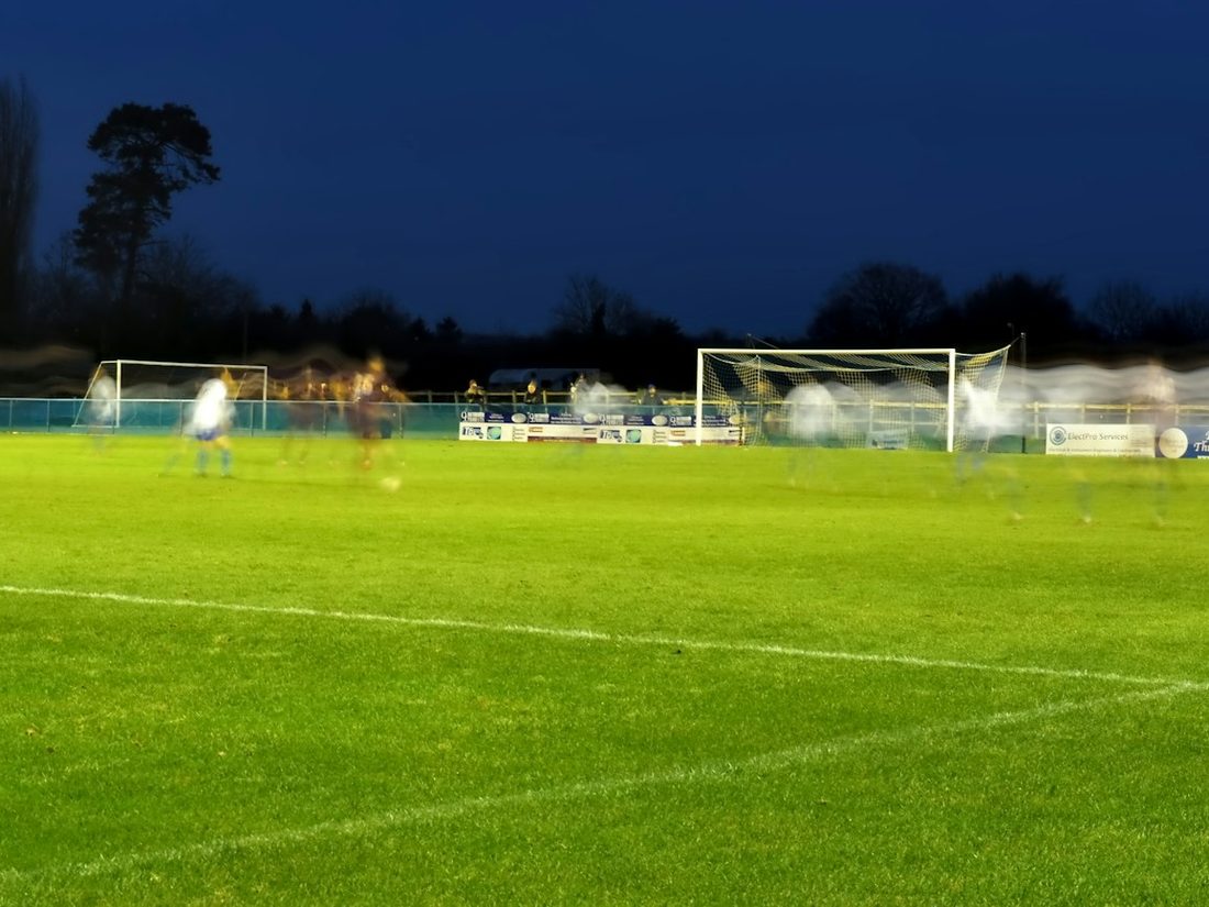 Players training under floodlights